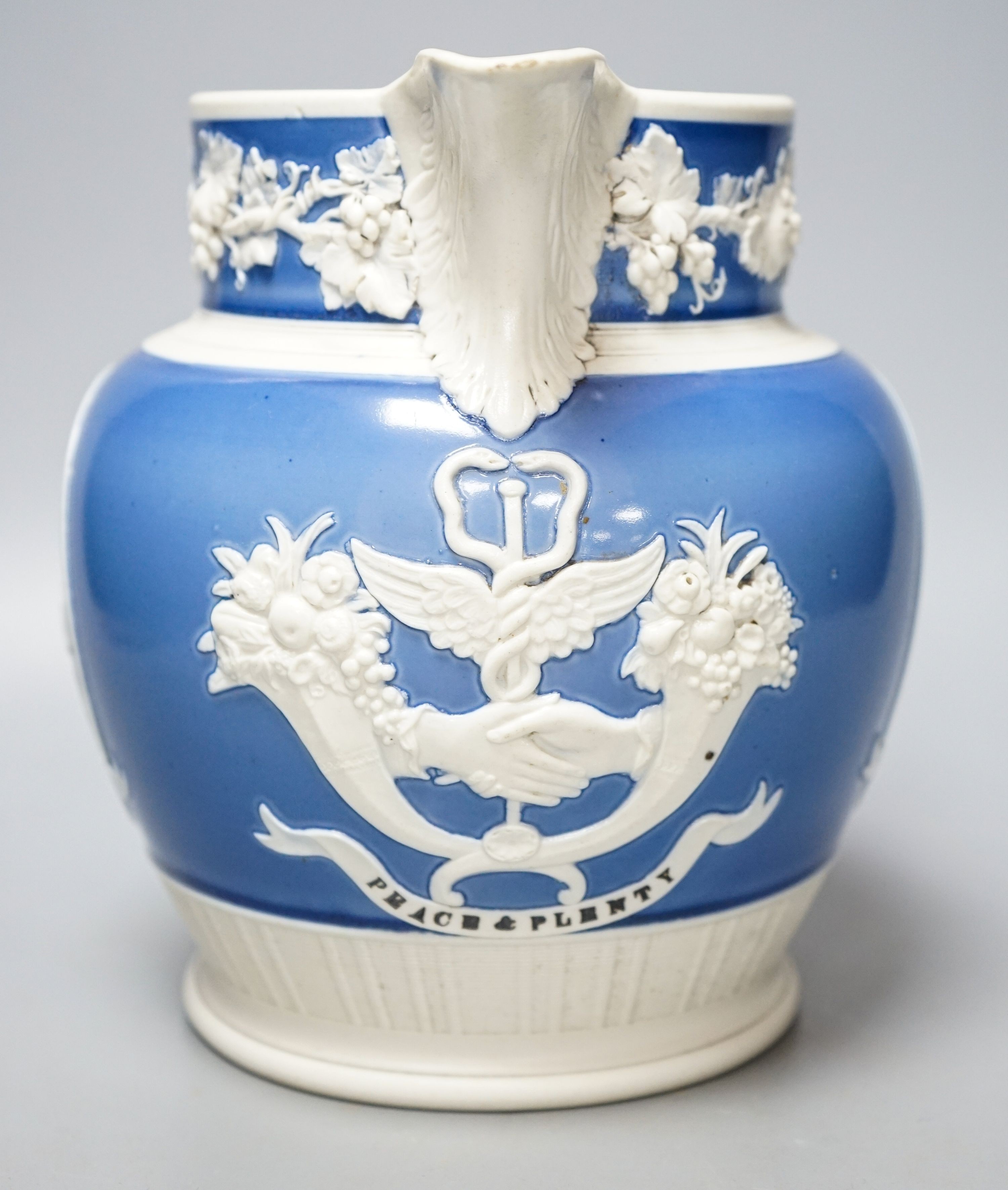 An early 19th century Wellington & Blucher commemorative peace & plenty jasper ware style jug 19cm